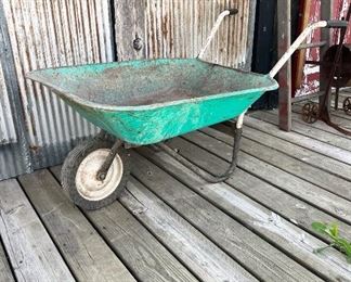 Green metal wheelbarrow