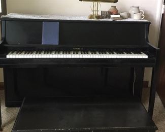 A Kimball piano and bench, along with receipt to show it’s last tune-up, is ready for a new home and entertaining. 