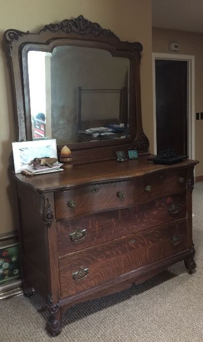 This oak dresser is stylish with plenty of space to stow clothes, linen or other goods. It would even be a wonderful stand-in for a buffet. 