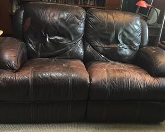 Leather loveseat is super comfy with lots of life left. Perfect for family rooms, guy caves or most any room. 