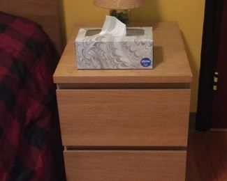 Bedside table with clean lines and room to stow a book, journal or other goods. 
