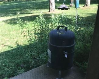 A Brinkman smoker is wood-fired and ready to smoke meat, cheeses and veggies. 