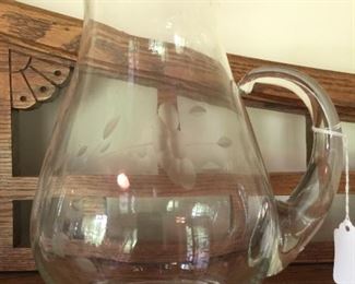 A larger etched-glass pitcher. 