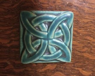 A Pewabic tile with a Celtic knot. 