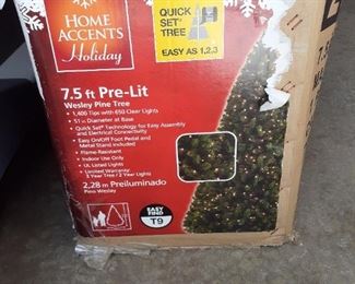 7.5 foot pre-lit Christmas tree $25
