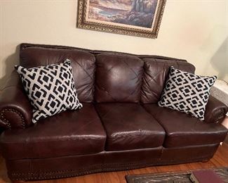 Leather like couch with art from Local artist Barbara Faulkner framed art, I framed on canvas, paint board and art paper. Matting and many frames you can fill with your favorites. 
