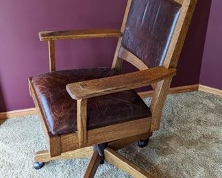 Stickley Rolling Leather Office Chair. There is some light wear on the arms and leather but in overall great condition. Measures 26” wide, 20” deep and 39” high to the chair back.