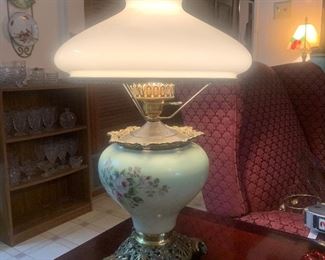 white porcelain and brass hurricane lamp