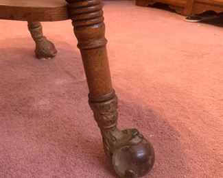 brass eagle claw, glass eye feet on oak clover leaf parlor game table