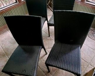 Set of four woven rattan chairs