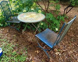 Amazing jungle animal mosaic bistro table and two metal chairs.