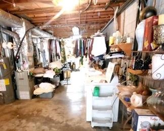 Lots of good things in this large basement, including shelves, cabinets, work tables, work bench, vintage trunks, freezer, clothing, Tablecloths, almost new washer and dryer by Whirlpool