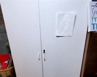 Very nice large storage closet or.cabinet with shelves inside, lock and key for door