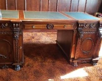 Gorgeous Carved Partners Desk with Leather top inserts. Measures: 79"W x 41"D x 31"H Has some damage on one of the doors and another area. Asking $4995 obo Have matching Credenza Ex condition Measures 80"W x 18.5"D x 35.5"H Asking $4995 obo Both pieces $9500 obo