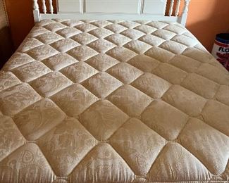 Double bed with white headboard