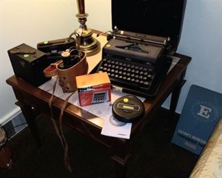 Vintage cameras, binoculars, Royal Quiet Deluxe portable typewriter