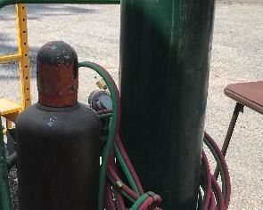 Gas cylinders with hoses and stand