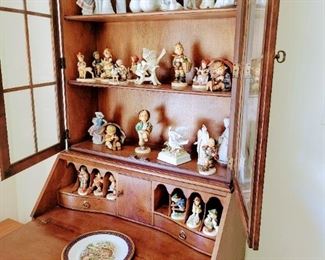 Beautiful desk filled with collectibles