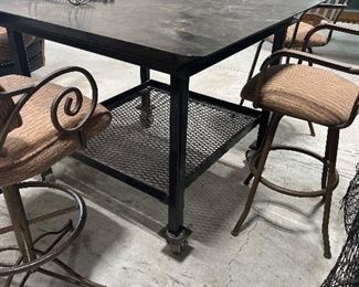 Really cool bar height industrial style table on wheels.  Would be great in a shop or on a patio!