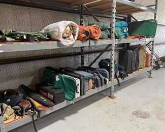 Tons of camping gear and gun cases