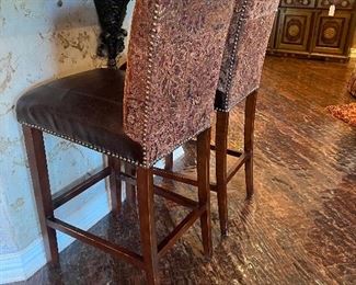 2 leather and upholstered barstools.