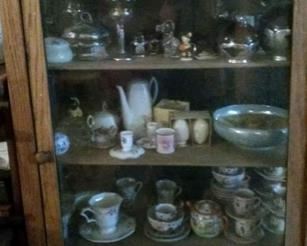 Another hutch filled with occupied Japan small vintage figurines and topped with     cut crystal vases, and misc collectibles                                                                                                                                                                                                                                                                                                                                                                                                                                                                                                                                                                                                                                                                                                                                                                                                                                                                                                           