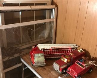 Some vintage  metal vehicles, including a fire truck with moving parts, a truck and a jeep.  We also have a peddlecar or two if interested let me know when here.