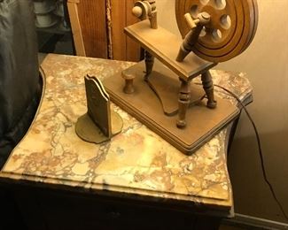 adorable spinning wheel lamp that works perfectly, with brass book ends atop a fabulous marble topped boudior end table. 