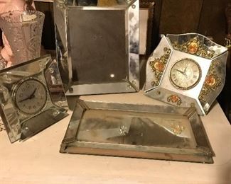 two mirrored electric boudoir  clocks, mirrored vanity tray, and shapely beveled mirror in portrit style stand, Victorian style