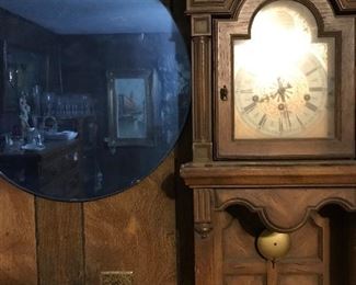 art deco blue wall mirror and vintage smaller grandfather style clock