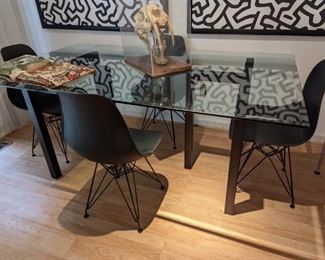 Modern dining room table with heavy glass top