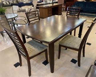 Dining Table and 5 Chairs.  The leaf folds under the table for easy in and out.