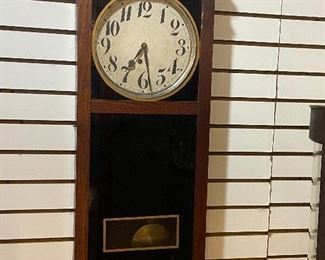 Old wall clock in working order.
