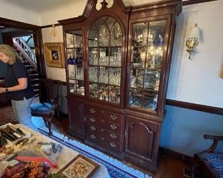 . . . a beautiful Duncan-Fife style china cabinet -- great finial and full of treasures!