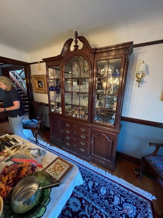 . . . a beautiful Duncan-Fife style china cabinet -- great finial and full of treasures!