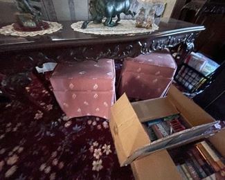 . . . two matching ottomans under a beautiful sofa table
