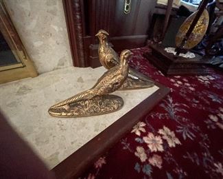 . . . a pair of matching brass birds