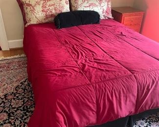 . . . a beautiful full-sized bed with complimentary bedding