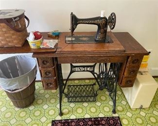 . . . an early 1900's oak Singer sewing machine