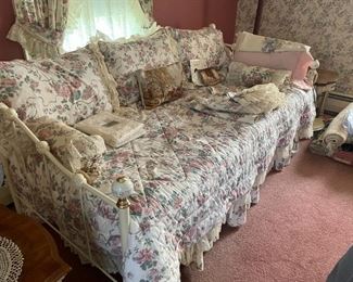 . . . a nice wrought iron daybed in white and brass