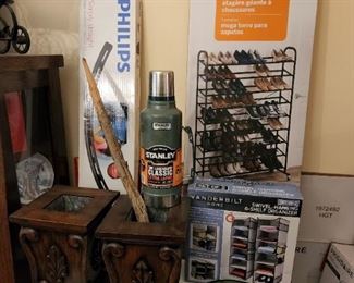 New, unopened flat screen TV wall mount, unopened shoe rack and closet organizer