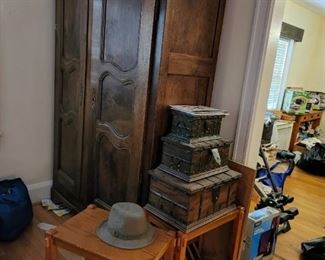 Tall armoire and set of 3 trunks