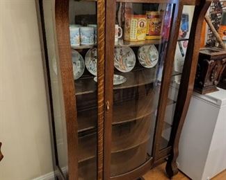 antique curved glass cabinet