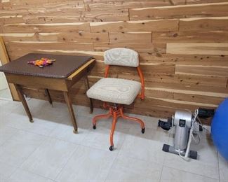Old sewing table and vintage office chair
