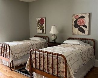 Pair antique spool style twin bedframes with matching antique bed linens, pillows, and blankets