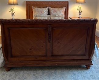 Sleigh bed frame featuring an ornate carved design, with pillows, bedspread, linens, and mattress, 96x64