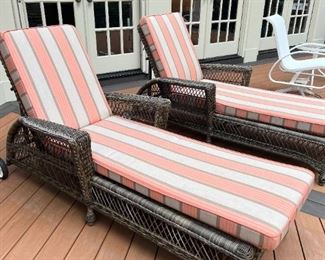 Pair rattan-style loungers with stripped cushions