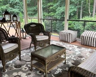 Rattan-style patio furniture, Pair of armchairs and sofa with cushions, coffee table with glass top