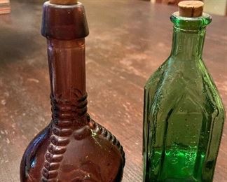 Approximately 3” Miniature Bottles with original corks- Vintage Ball & Claw Bottle 
1970’s Chief Wahoo Electric Tonic Bottle 