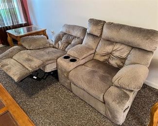 Powered reclining sofa